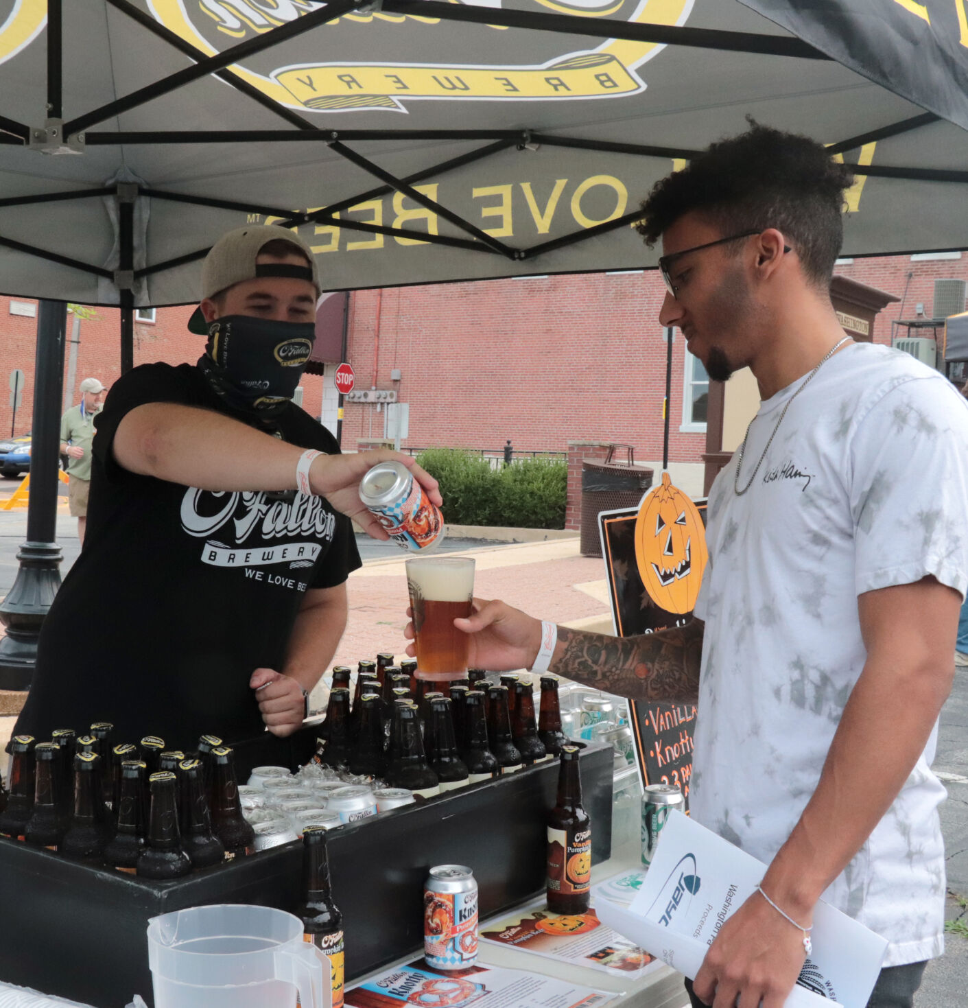 Nick Lindgren re-enacts pouring Landon Bellamy's beer